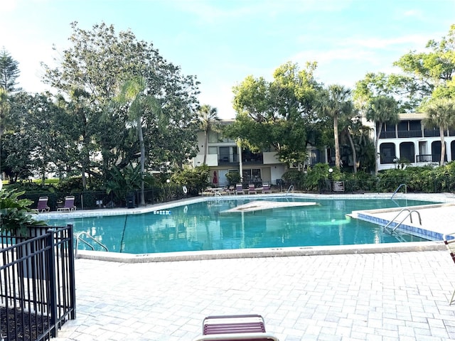 community pool featuring a patio area
