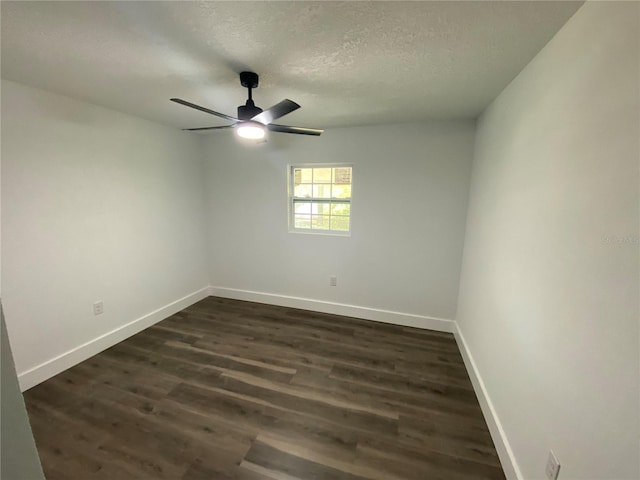 545 Brooks Ct, Polk City, FL 33868 - unfurnished room with a textured ceiling, baseboards, ceiling fan, and dark wood-style floors