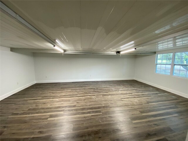 545 Brooks Ct, Polk City, FL 33868 - interior space featuring baseboards and dark wood-style flooring