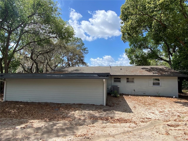 545 Brooks Ct, Polk City, FL 33868 - back of house with central AC unit