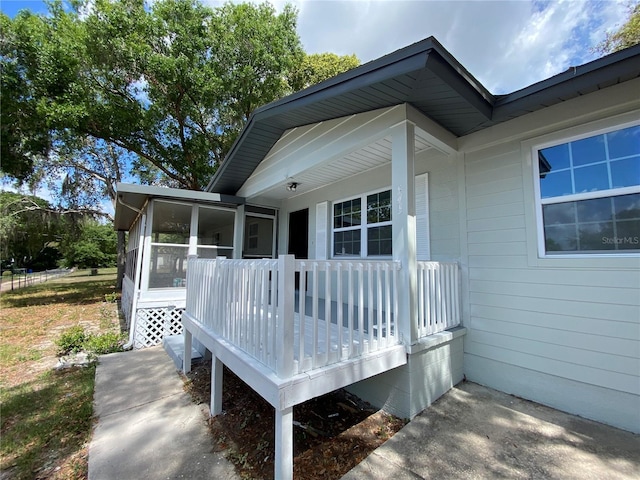545 Brooks Ct, Polk City, FL 33868 - deck with a sunroom