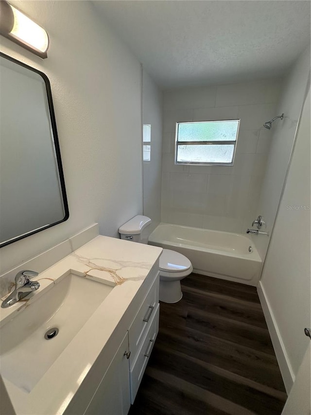 545 Brooks Ct, Polk City, FL 33868 - full bath with washtub / shower combination, wood finished floors, toilet, and vanity
