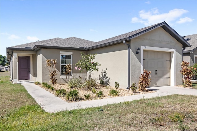 392 Kensington View Dr, Winter Haven, FL 33880 - ranch-style home featuring a garage, roof with shingles, concrete driveway, and stucco siding