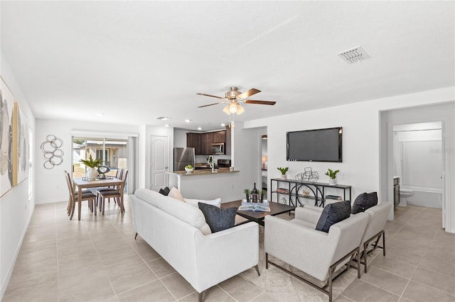 392 Kensington View Dr, Winter Haven, FL 33880 - living area with baseboards, a ceiling fan, light tile patterned flooring, and visible vents