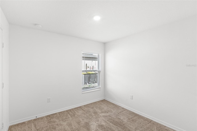 392 Kensington View Dr, Winter Haven, FL 33880 - empty room with light colored carpet, baseboards, and recessed lighting