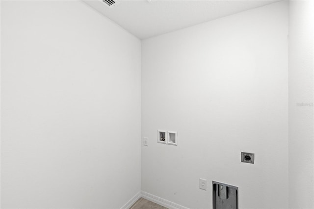 392 Kensington View Dr, Winter Haven, FL 33880 - washroom with hookup for an electric dryer, visible vents, baseboards, washer hookup, and laundry area