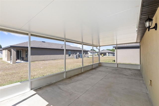 392 Kensington View Dr, Winter Haven, FL 33880 - unfurnished sunroom featuring a residential view