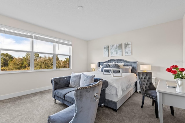 carpeted bedroom with baseboards