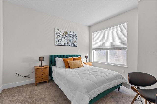 carpeted bedroom with baseboards