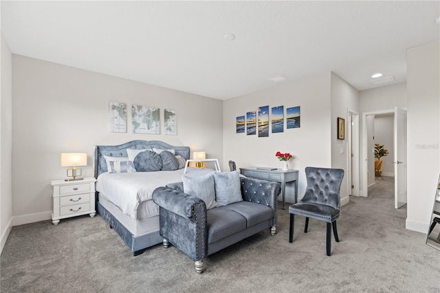 carpeted bedroom featuring baseboards