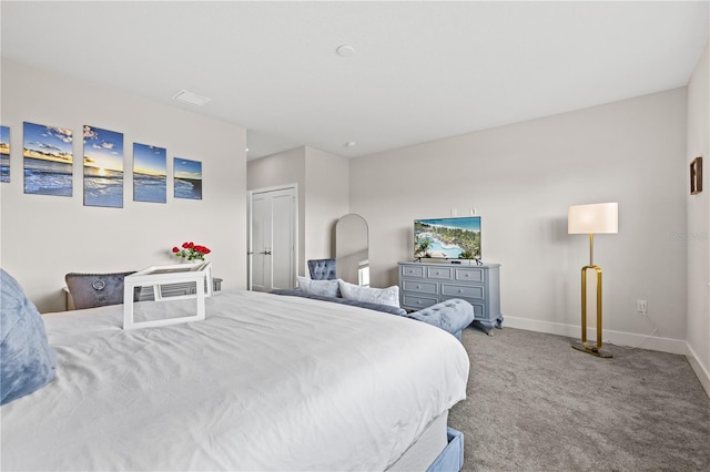carpeted bedroom with baseboards