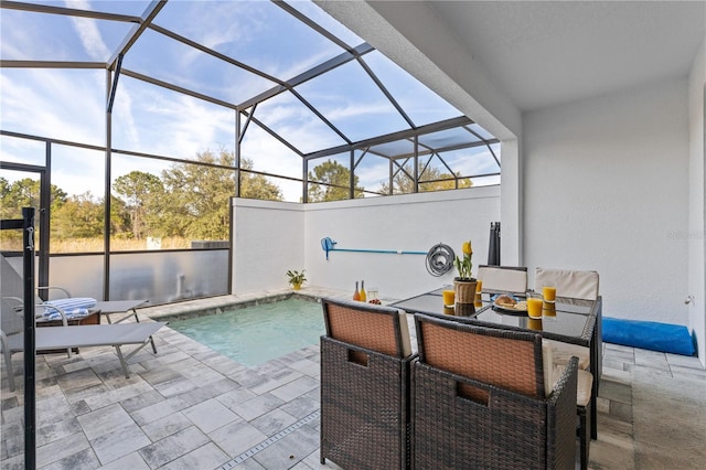 outdoor pool featuring a lanai and a patio area