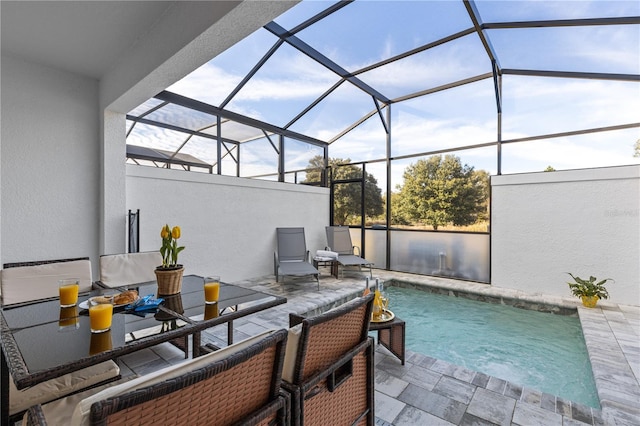 view of patio / terrace featuring a lanai and an outdoor pool