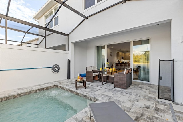 view of pool featuring a swimming pool, outdoor lounge area, and a patio area