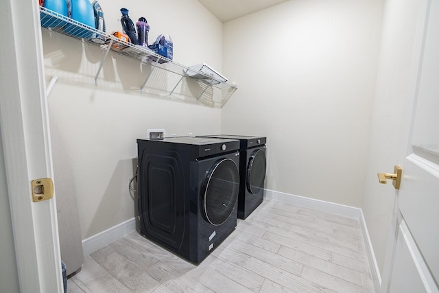 4012 Meandering Bay Dr, Apopka, FL 32712 - laundry room featuring washing machine and dryer, baseboards, and light wood finished floors
