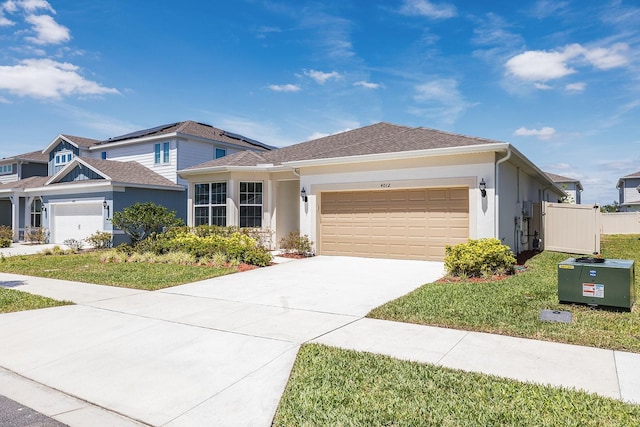 4012 Meandering Bay Dr, Apopka, FL 32712 - view of front of property with a garage, stucco siding, concrete driveway, and fence