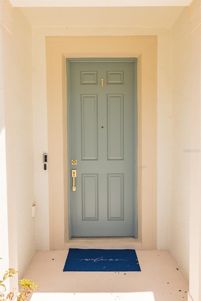 4012 Meandering Bay Dr, Apopka, FL 32712 - doorway to property featuring stucco siding
