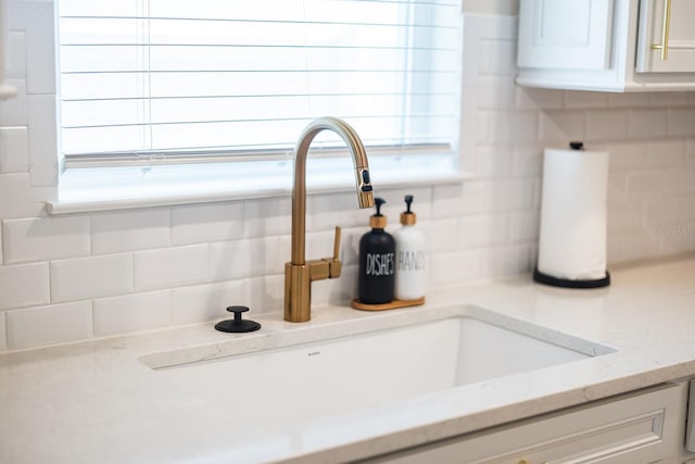4012 Meandering Bay Dr, Apopka, FL 32712 - detailed view of a sink and tasteful backsplash