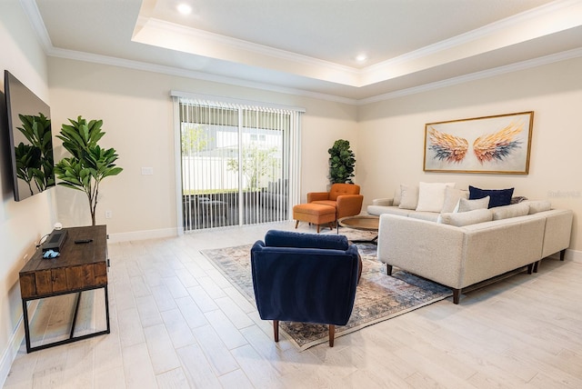 4012 Meandering Bay Dr, Apopka, FL 32712 - living room with light wood finished floors, a tray ceiling, ornamental molding, baseboards, and recessed lighting