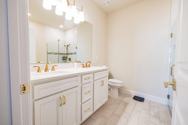 4012 Meandering Bay Dr, Apopka, FL 32712 - full bathroom featuring a stall shower, double vanity, toilet, wood finished floors, and baseboards