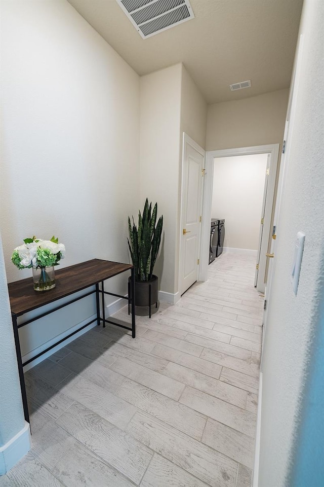 4012 Meandering Bay Dr, Apopka, FL 32712 - hall with light wood-type flooring and baseboards