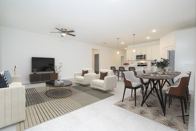 living room featuring recessed lighting and ceiling fan