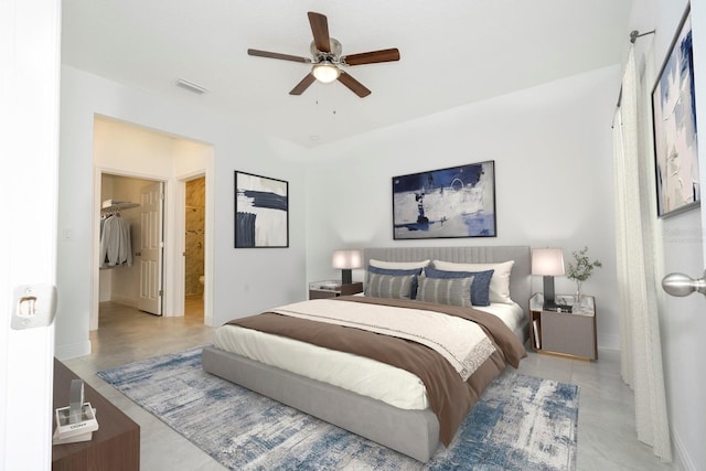 bedroom with visible vents, a ceiling fan, and ensuite bathroom