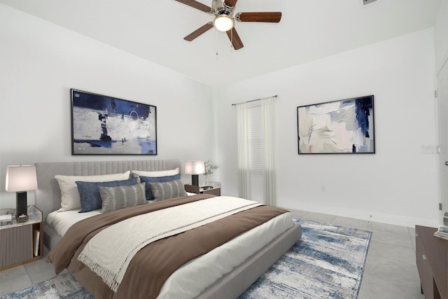 tiled bedroom with baseboards and ceiling fan