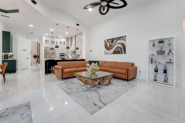 living room with crown molding, ceiling fan, arched walkways, recessed lighting, and marble finish floor