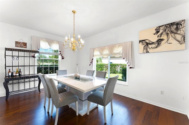 219 Strathmore Cir, Kissimmee, FL 34744 - dining space featuring an inviting chandelier, dark wood-style floors, and baseboards