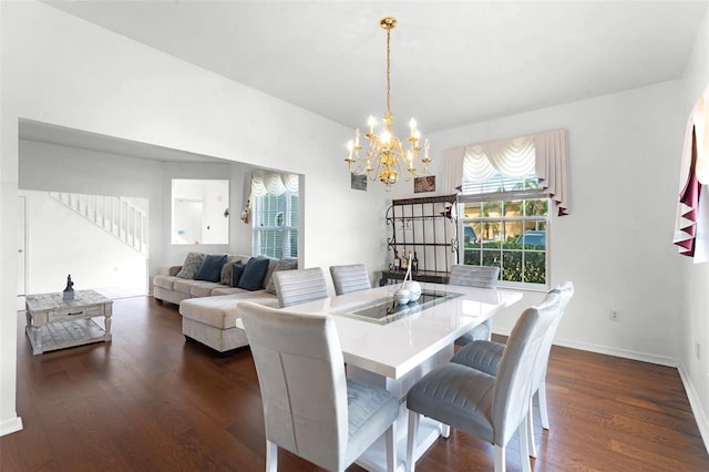 219 Strathmore Cir, Kissimmee, FL 34744 - dining room with stairs, dark wood-style flooring, a chandelier, and plenty of natural light