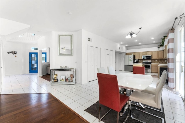 219 Strathmore Cir, Kissimmee, FL 34744 - dining area featuring recessed lighting, an inviting chandelier, visible vents, and light tile patterned floors