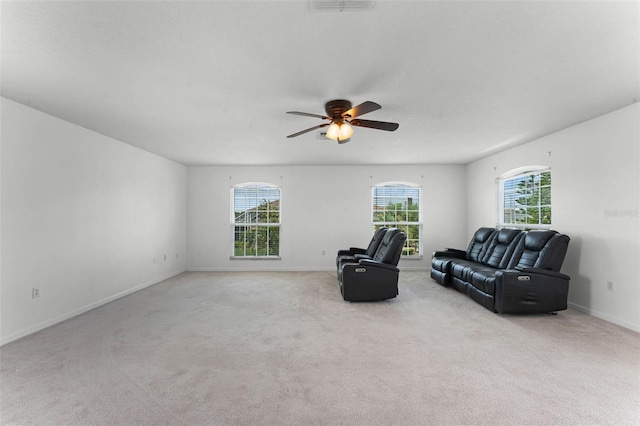 219 Strathmore Cir, Kissimmee, FL 34744 - unfurnished room with ceiling fan, light carpet, baseboards, and plenty of natural light