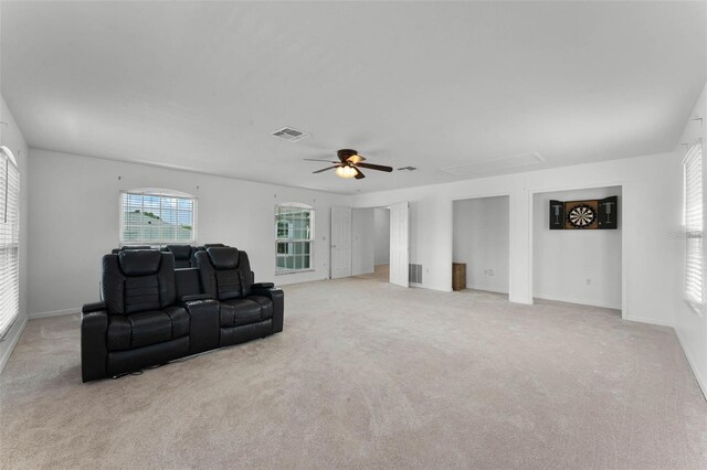 219 Strathmore Cir, Kissimmee, FL 34744 - carpeted living area featuring attic access, ceiling fan, baseboards, and visible vents