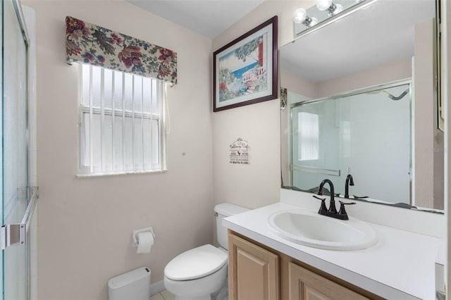 219 Strathmore Cir, Kissimmee, FL 34744 - bathroom featuring a shower stall, toilet, and vanity