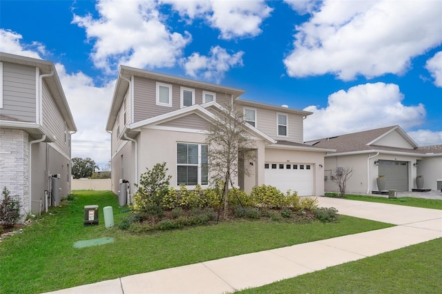 traditional-style house with concrete driveway, a front yard, stucco siding, and a garage