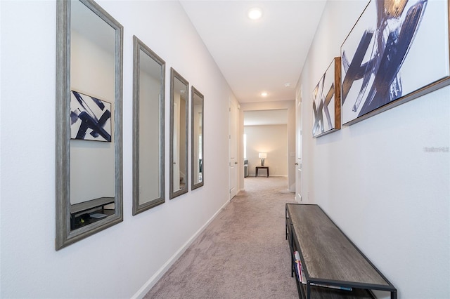corridor featuring recessed lighting, baseboards, and carpet floors