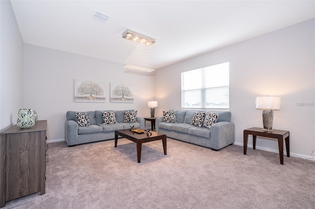 living room with visible vents, baseboards, and carpet flooring