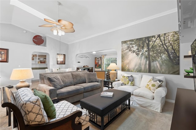 26901 Racquet Cir, Leesburg, FL 34748 - living room with lofted ceiling, crown molding, ceiling fan, baseboards, and arched walkways