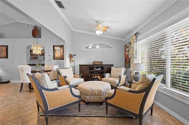 26901 Racquet Cir, Leesburg, FL 34748 - living area featuring ornamental molding, baseboards, tile patterned floors, and ceiling fan with notable chandelier