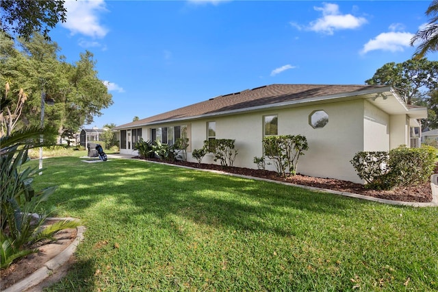 26901 Racquet Cir, Leesburg, FL 34748 - view of side of home featuring a lawn and stucco siding