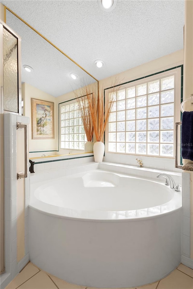 26901 Racquet Cir, Leesburg, FL 34748 - full bath with a garden tub, recessed lighting, and a textured ceiling