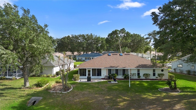 26901 Racquet Cir, Leesburg, FL 34748 - back of house with a lawn