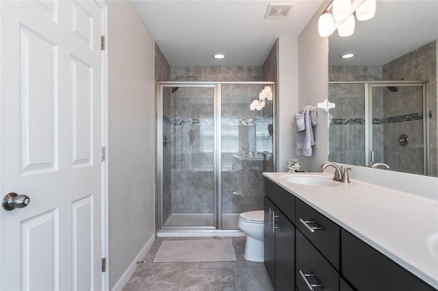 bathroom featuring visible vents, baseboards, and a stall shower