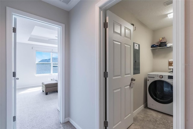 laundry area featuring laundry area, washer / dryer, baseboards, and electric panel