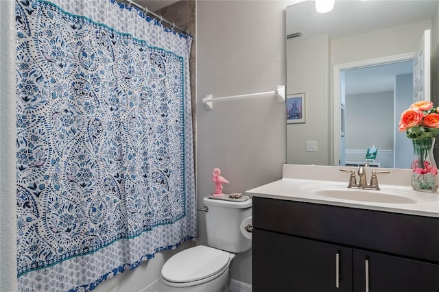 bathroom with vanity, a shower with curtain, toilet, and visible vents