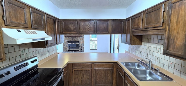 6277 Cranberry Ln W, Jacksonville, FL 32244 - kitchen featuring stainless steel electric stove, under cabinet range hood, backsplash, light countertops, and a textured ceiling