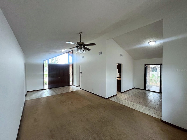 6277 Cranberry Ln W, Jacksonville, FL 32244 - unfurnished living room featuring light tile patterned flooring, light colored carpet, baseboards, a ceiling fan, and high vaulted ceiling