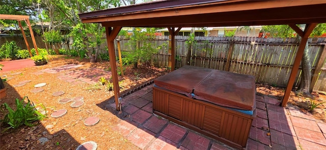 6277 Cranberry Ln W, Jacksonville, FL 32244 - fenced backyard with a hot tub and a patio