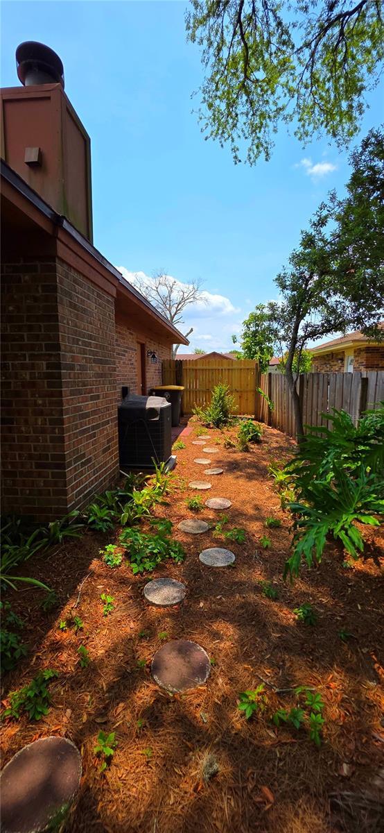 6277 Cranberry Ln W, Jacksonville, FL 32244 - view of yard featuring central AC unit